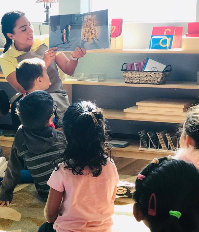 Ms. Monica reads to the Children's House Spanish immersion class at Guidepost Montessori in Frisco TX