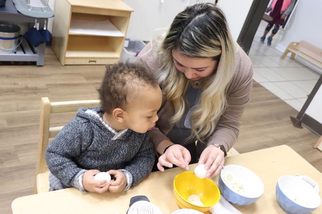 Best Private Montessori School Frisco, TX | Guide shows student how to peel eggs to make a snack | Guidepost Montessori