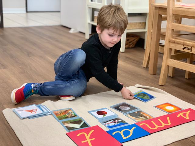 Student develops language by letter sounds and sorting at Guidepost Montessori at Stonebriar in Frisco TX